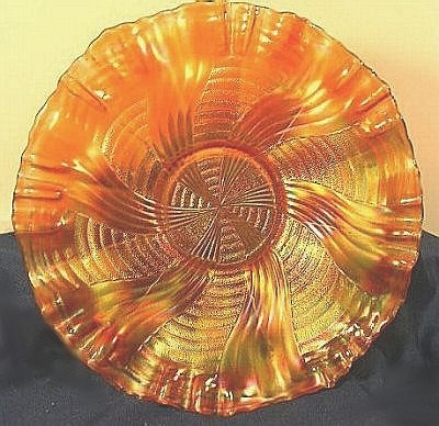 Fenton RIBBON TIE in 9.25 in.marigold (plate). No flat edge plates have been found. They all have the three and one edge.